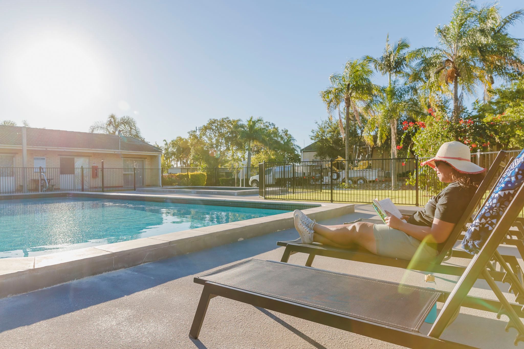 Ingenia Rental Eight Mile Plains resident relaxes by pool